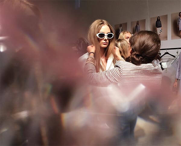 Backstage Action - The hive of activity backstage at the Burberry Prorsum SS14 womenswear show