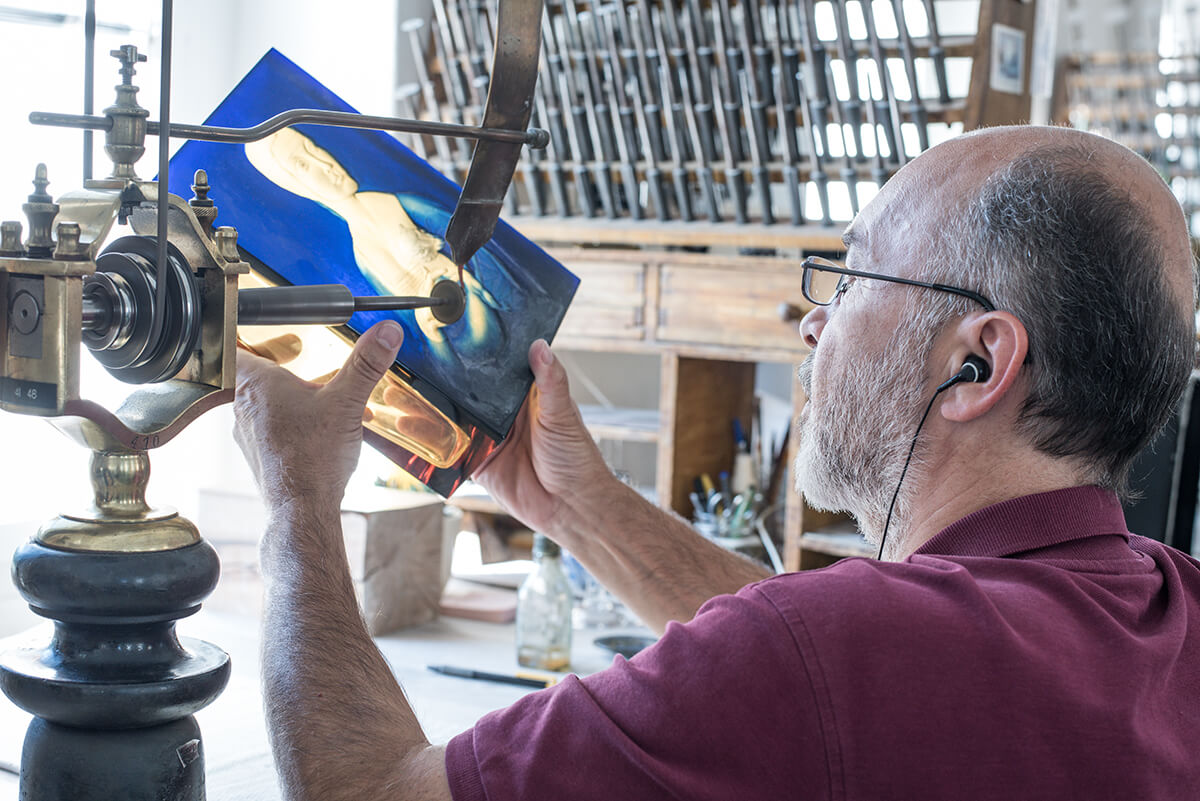 Glass engraving in the Moser glassworks workshop in Prague