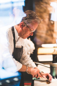 Chef prepares canapes to accompany the tasting of Masseto fine wines