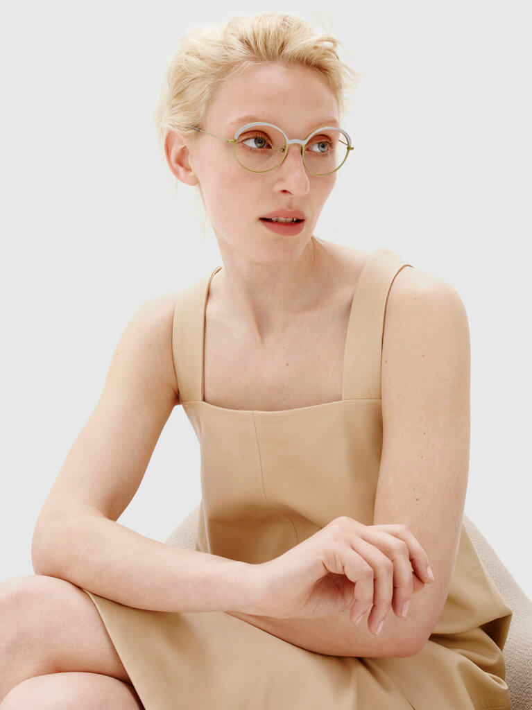 Lookbook image of model wearing luxury glasses by designer Tom Davies
