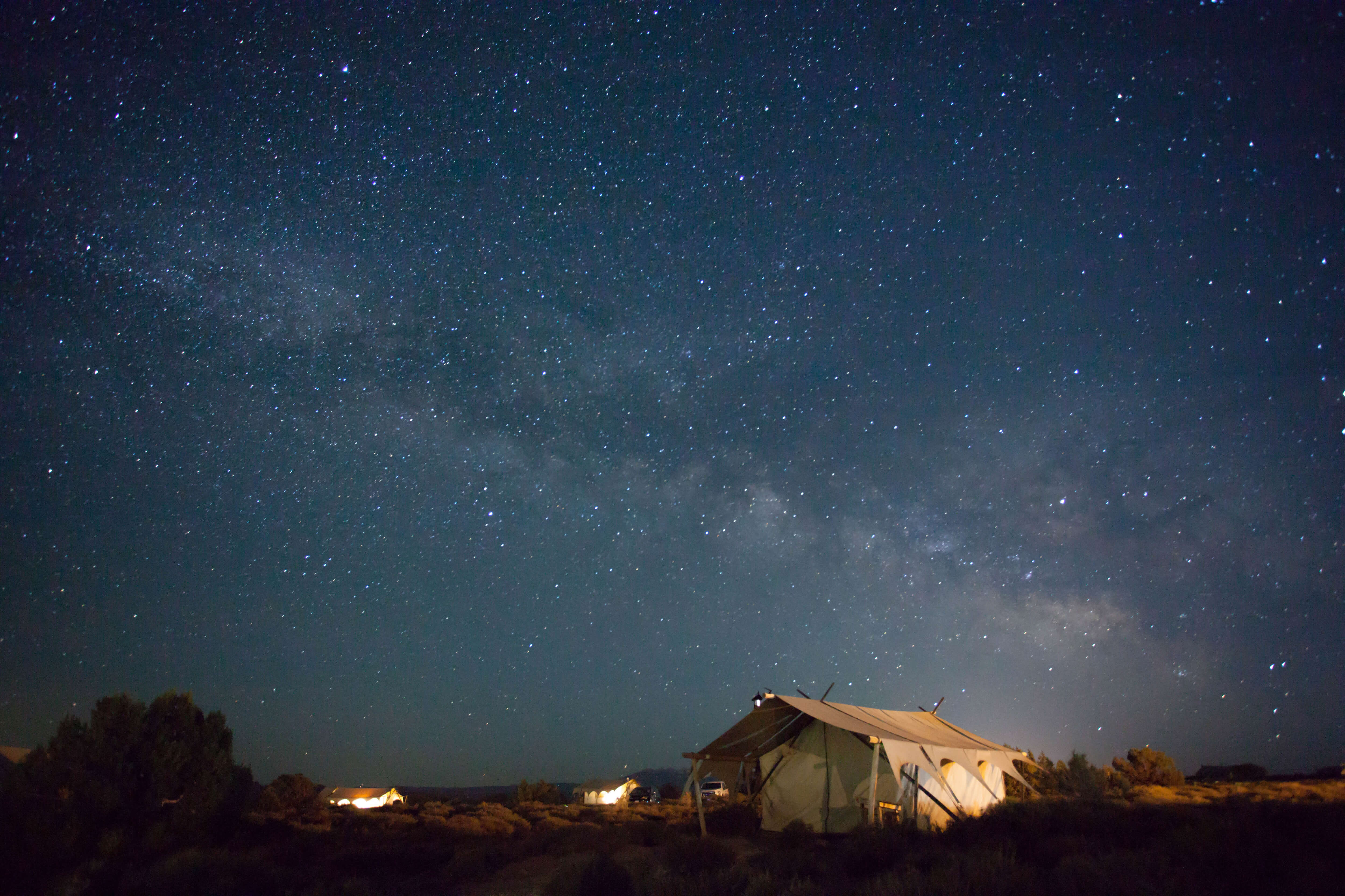 Luxury tent in desert under starry night