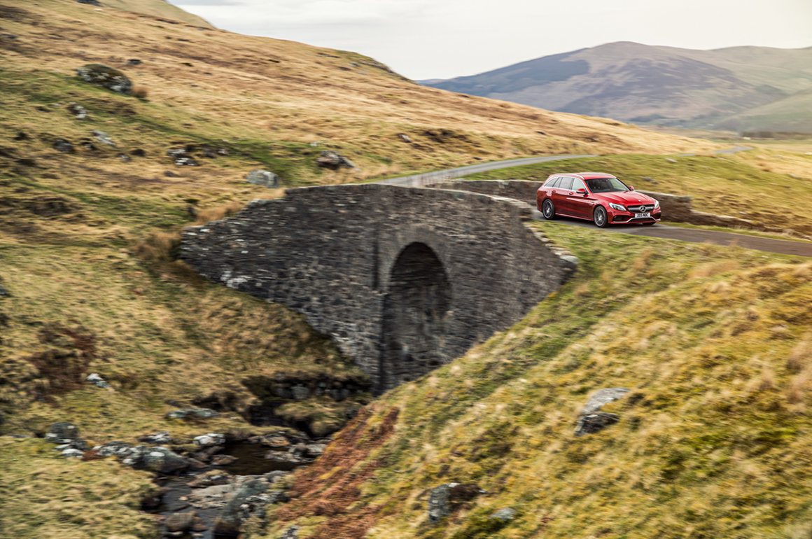Mercedes-AMG C 63 Estate car driving through the countryside