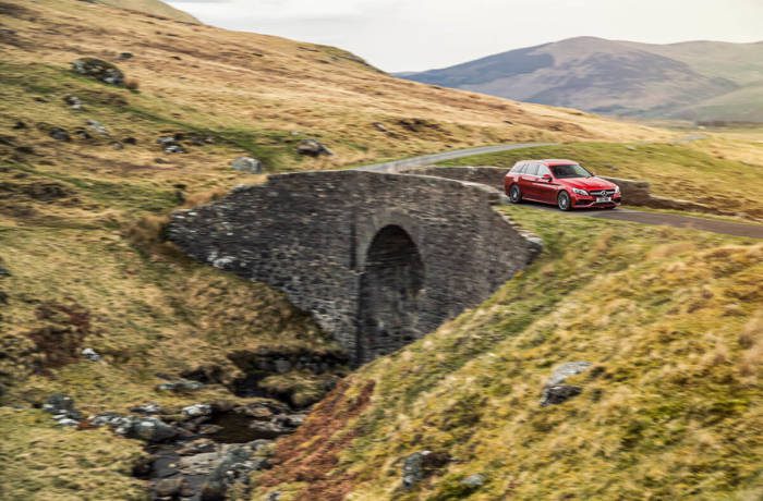 Mercedes-AMG C 63 Estate car driving through the countryside