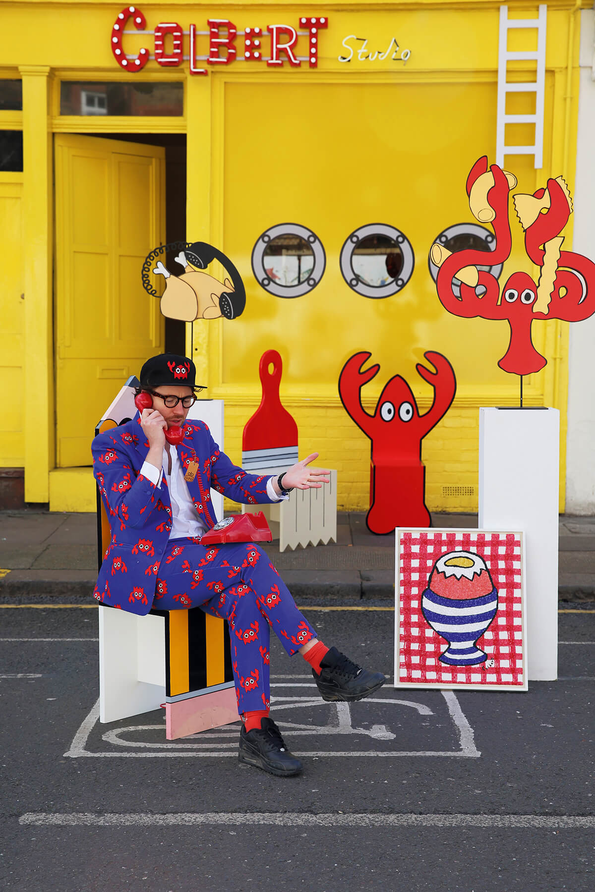 pop artist Philip Colbert photographed with his artworks in East London by photographer Maryam Eisler