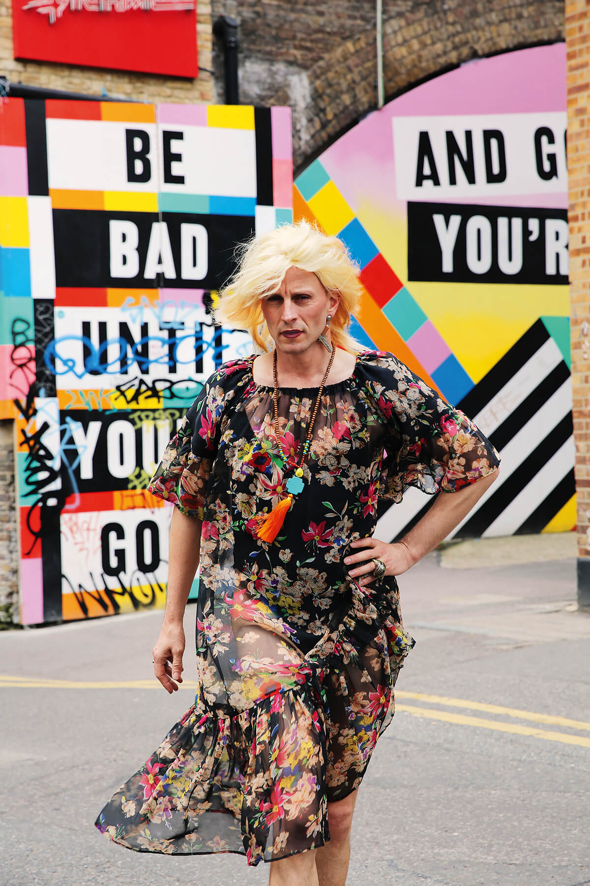 Portrait of drag artist Johnny Woo walking through the streets of East London by photographer Maryam Eisler