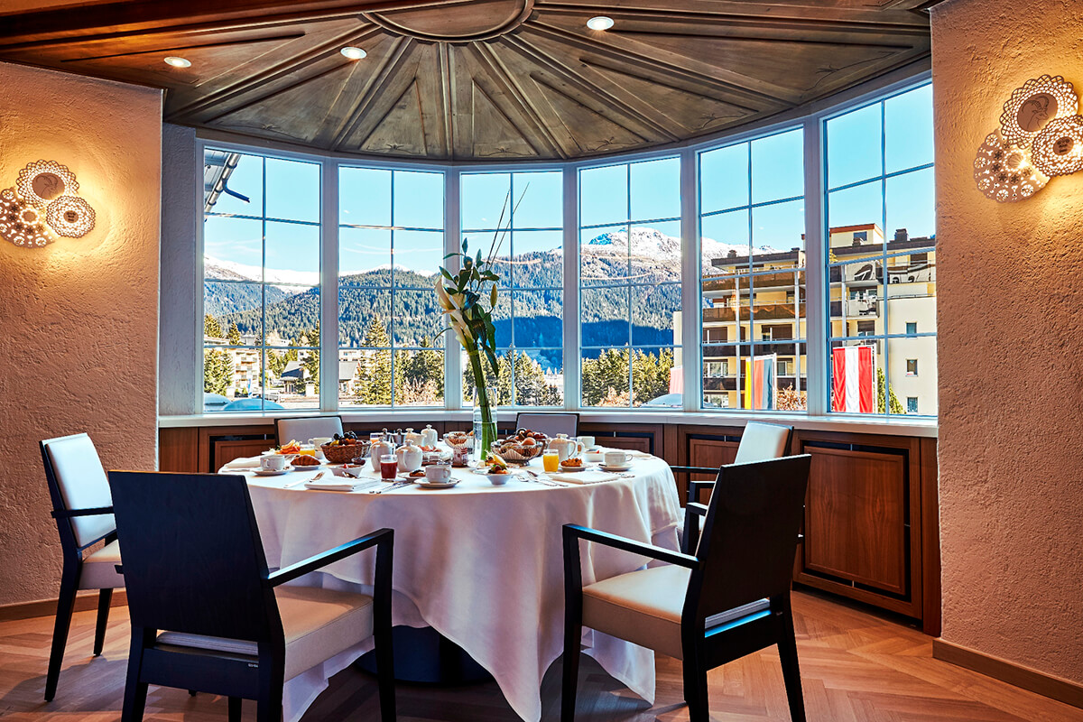 Dining table at the Belvedere restaurant in Davos, Switzerland with views of the alps