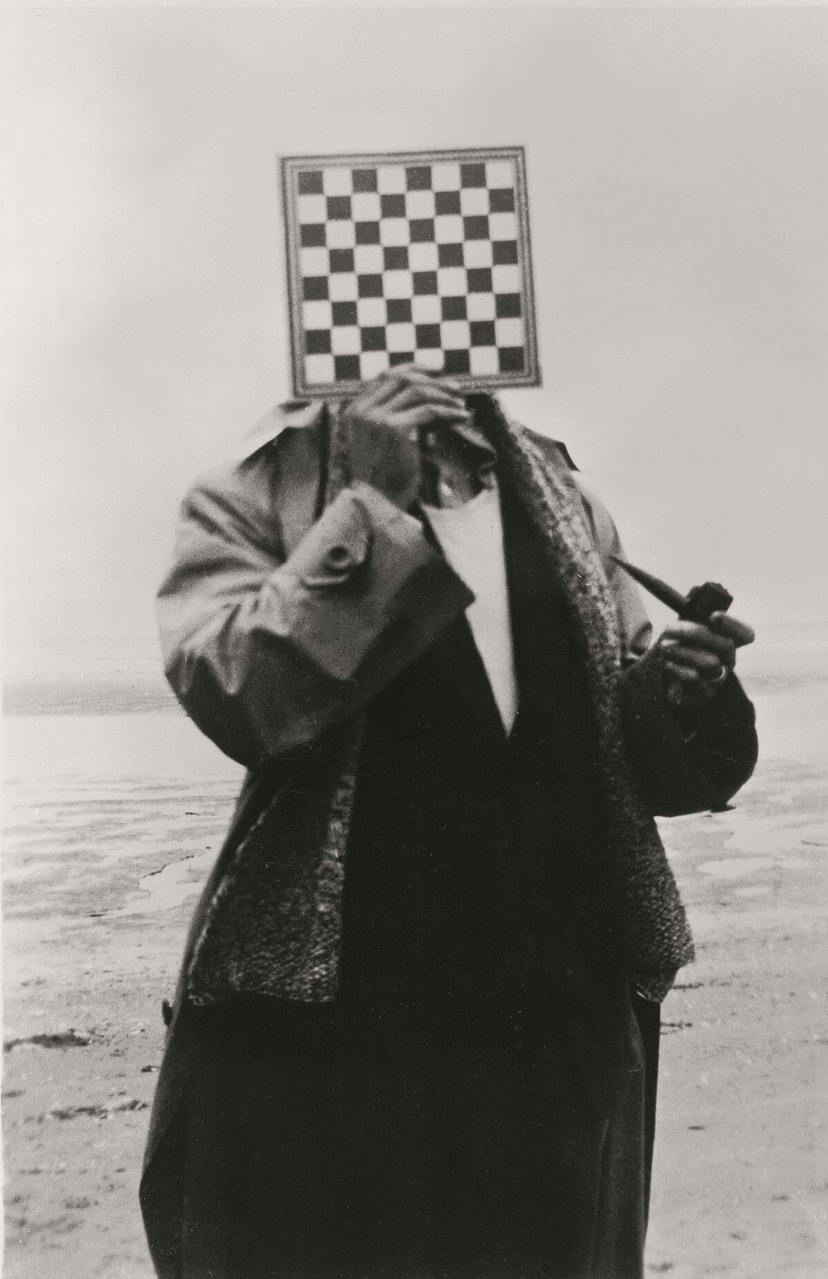 René Magritte portrait of a man with pipe and chess board