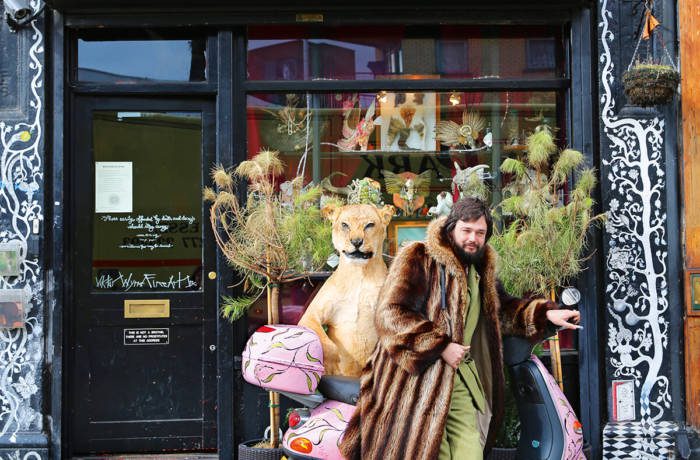 Portrait of artist Viktor Wynd outside of his museum in east London,