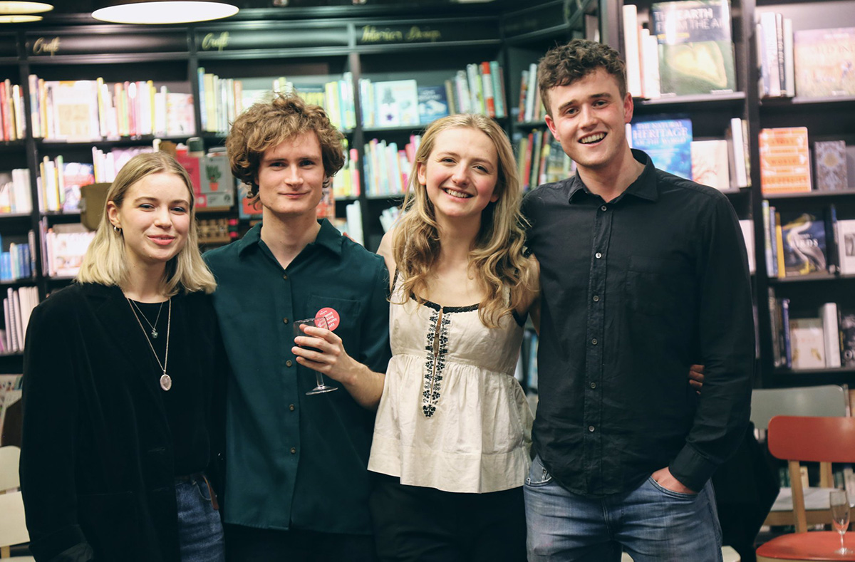 Oxford student magazine editors pose for photo in waterstones bookshop