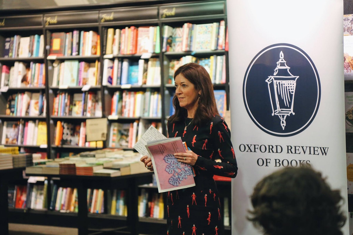 Author Victoria Hislop standing in book shop in front of audience