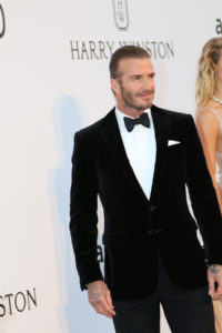 David Beckham posing in a black tuxe and bow tie