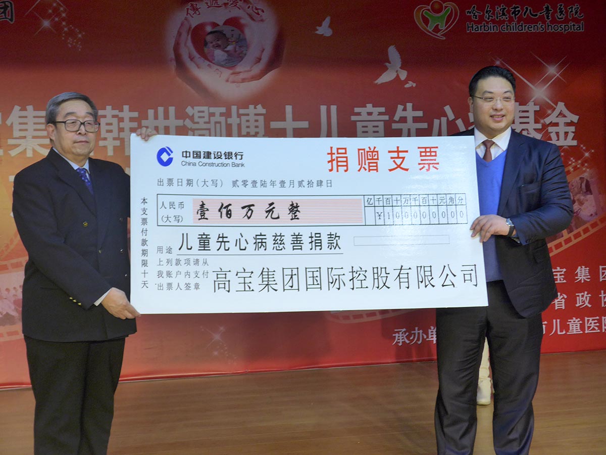 Charitable giant cheque handover on stage in Hong Kong