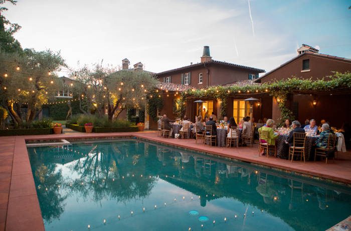 picturesque setting for dinner by the poolside at a luxury villa