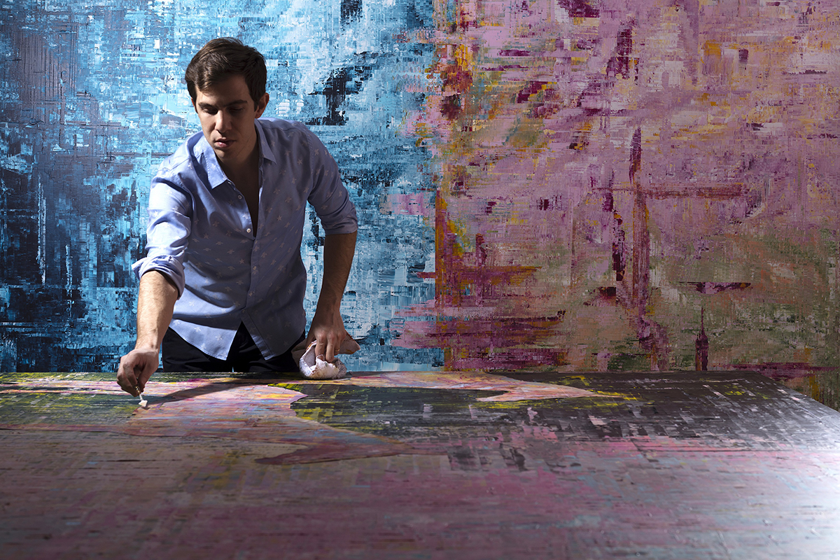 Artist Sassan Behnam-Bakhtiar working in his studio on large scale paintings