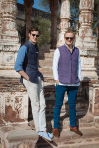 Tom Hudson British Polo Day Founder pictured with CEO Ben Vestey outside ancient building