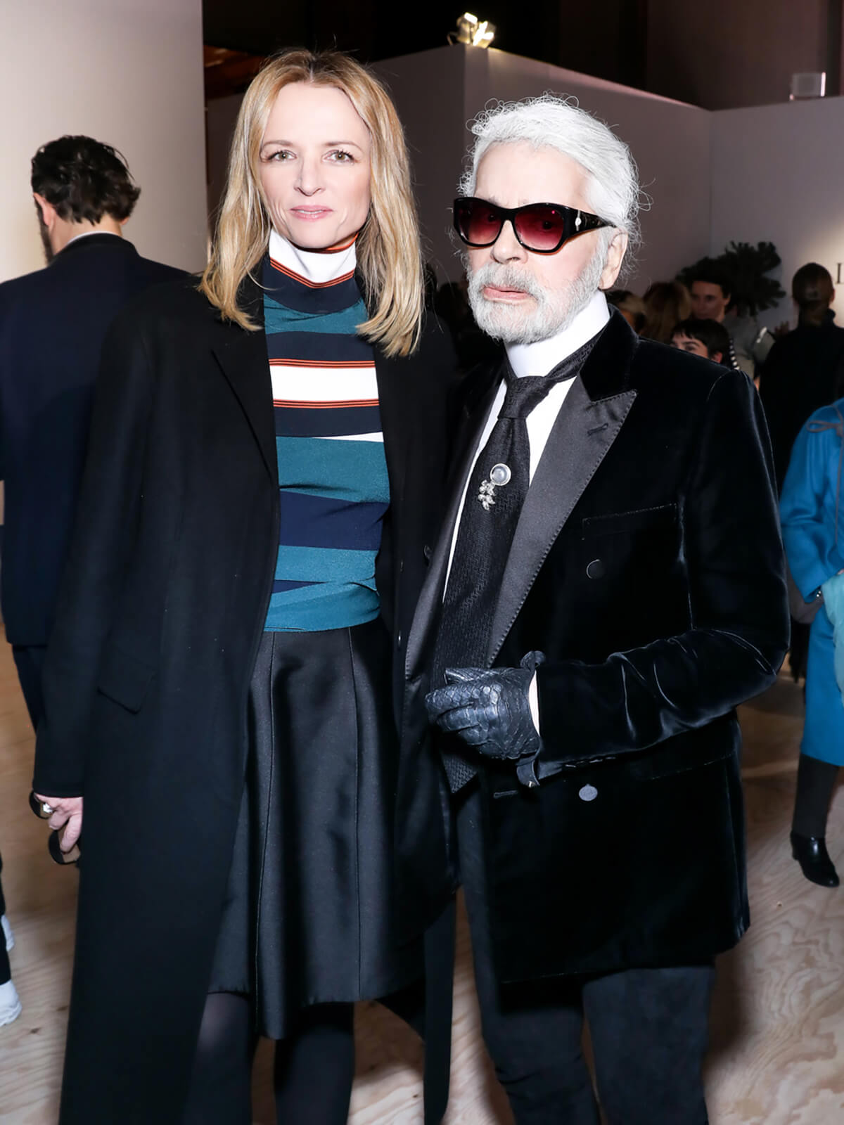 Designer Karl Lagerfeld pictured with LVMH's Delphine Arnault at a drinks party