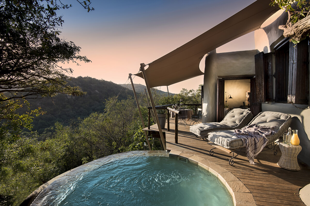 luxury suite overlooking mountains with plunge pool
