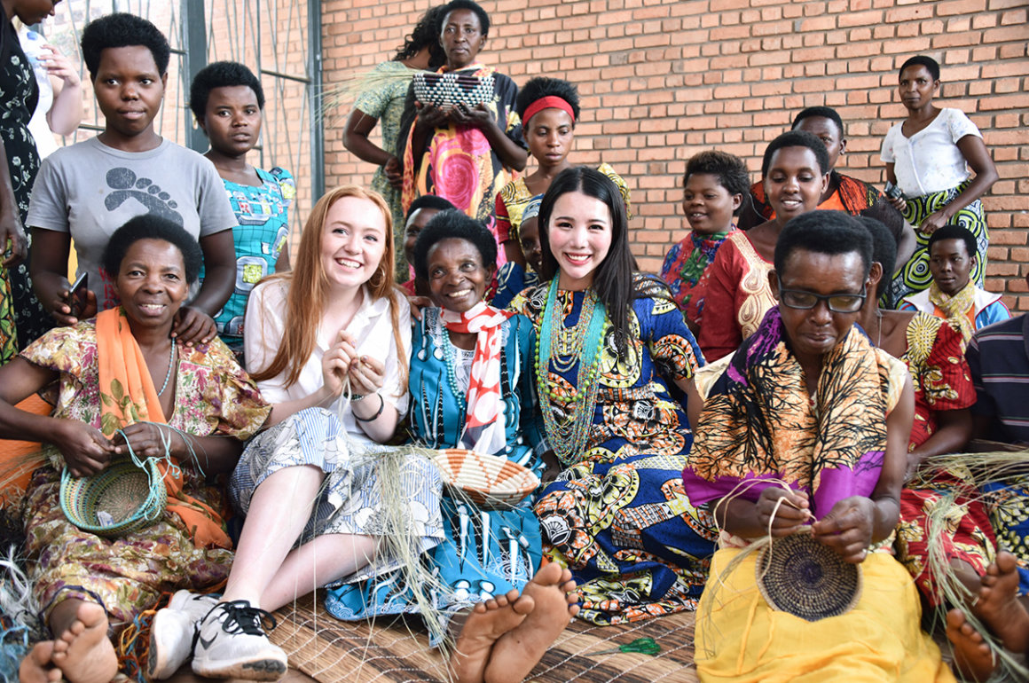 Entrepreneur Wendy Yu poses with locals from Rwanda
