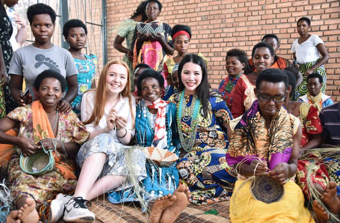 Entrepreneur Wendy Yu poses with locals from Rwanda