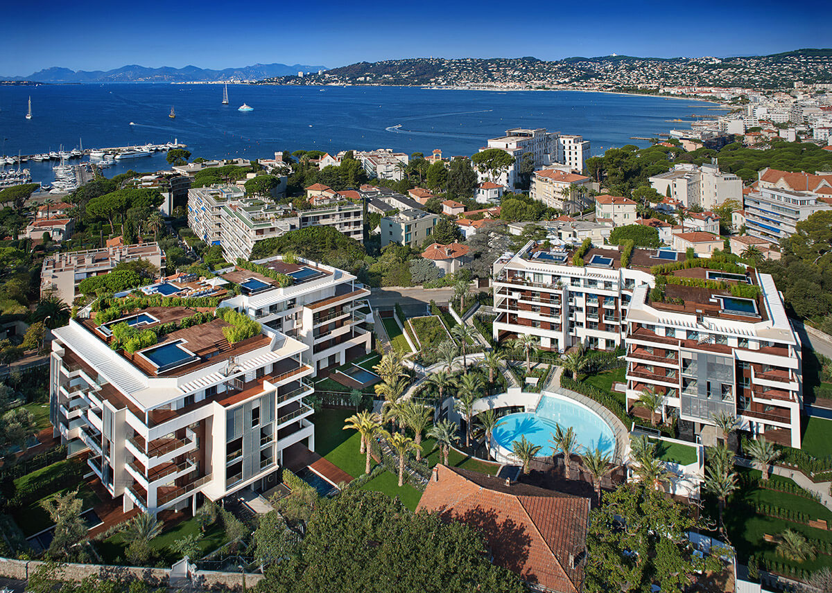 Aerial shot of seaside apartments with roof gardens