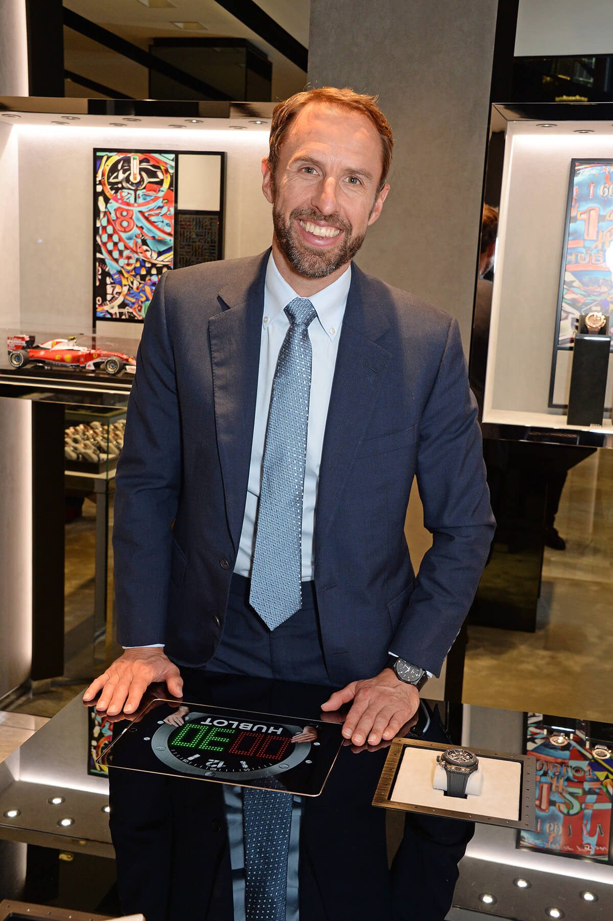 Football manager Gareth Southgate poses in shirt and suit 