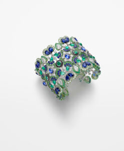 A cut out image of a diamond, sapphire and emerald cuff