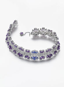 cut out image of a diamond choker necklace set with purple stones