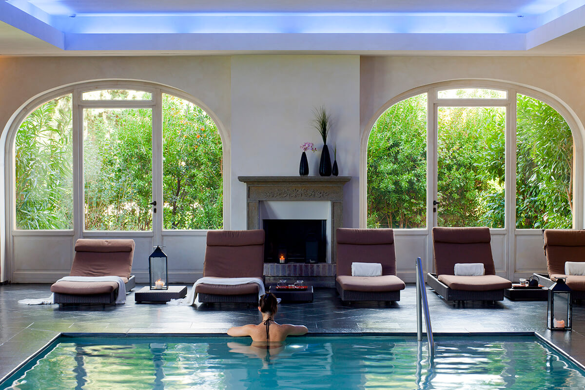 Luxury spa pool with surrounding loungers