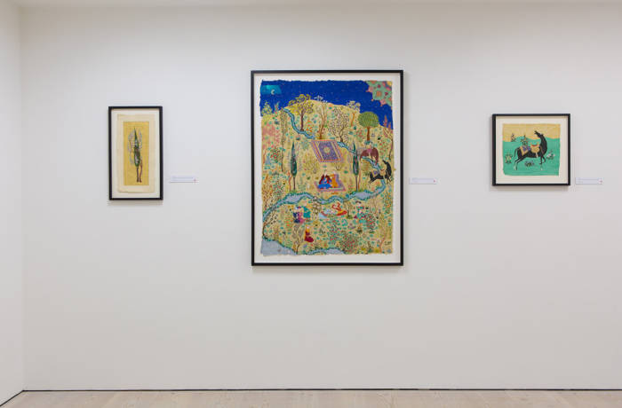 Three miniature style paintings hanging on display in a gallery setting