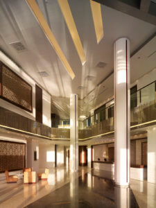 Luxurious hotel lobby with pillars and a neutral colour palette