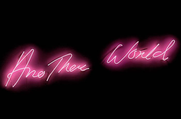 Neon pink lights spelling Another World in Italics