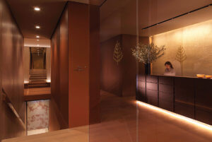 A spa reception decorated with warm woods 