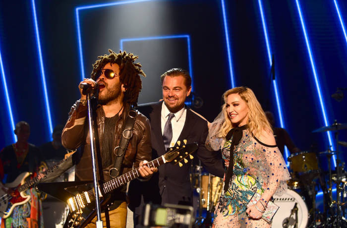 Singer Lenny Kravitz performs on stage with Leonardo DiCaprio and Madonna
