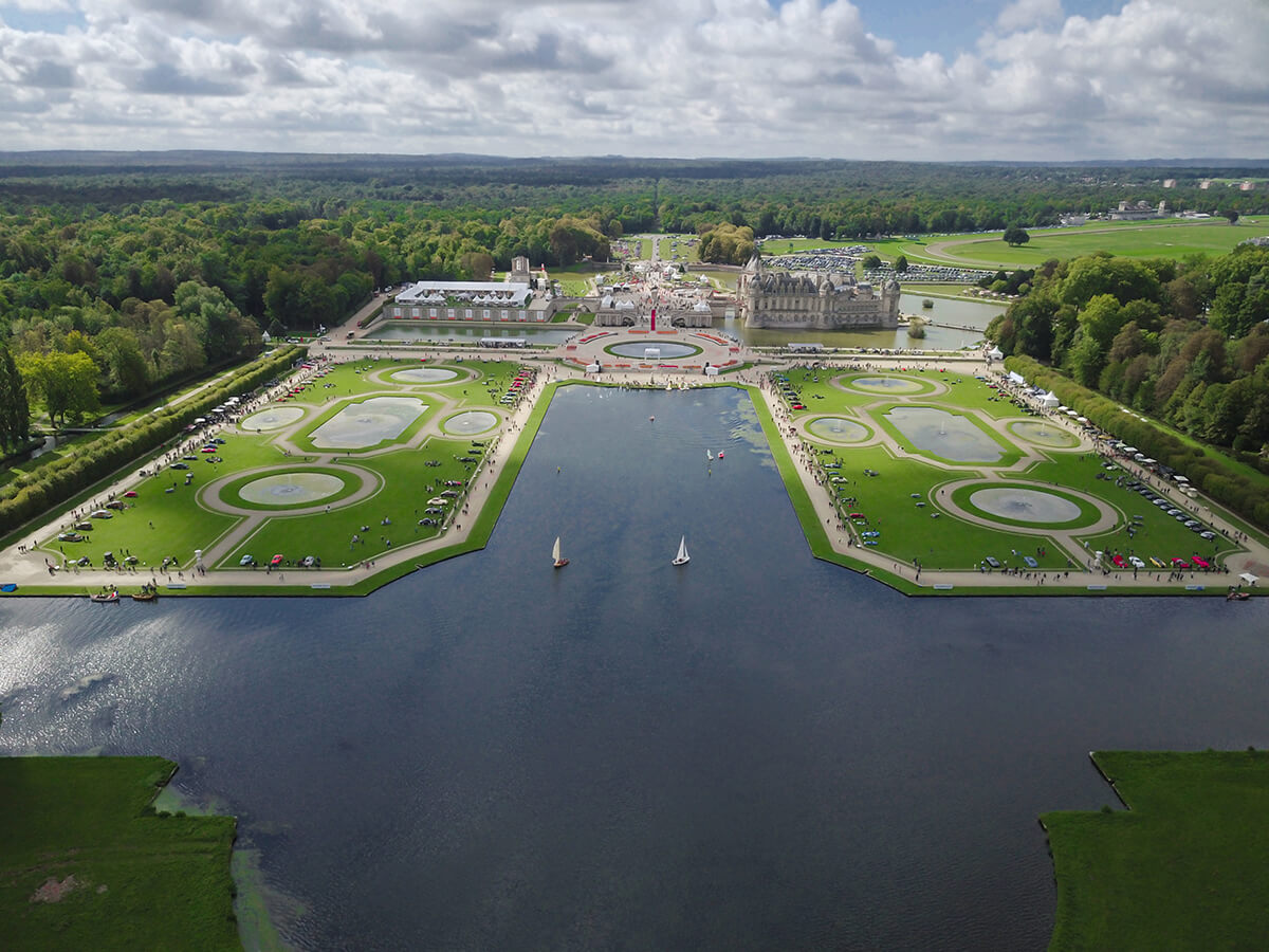 Bird's eye shot of a grand mansion house and estate