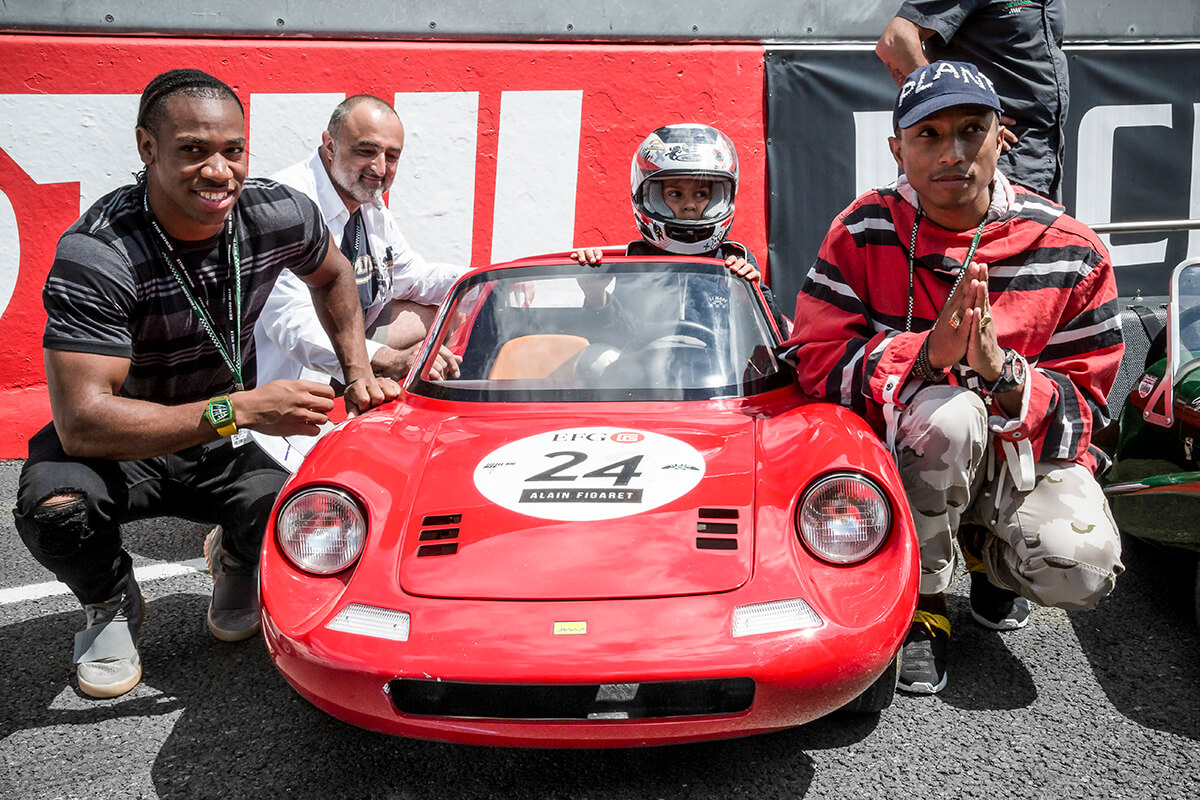 Singer Pharell and sprinter Yohan Blake at the Little Big Mans car race