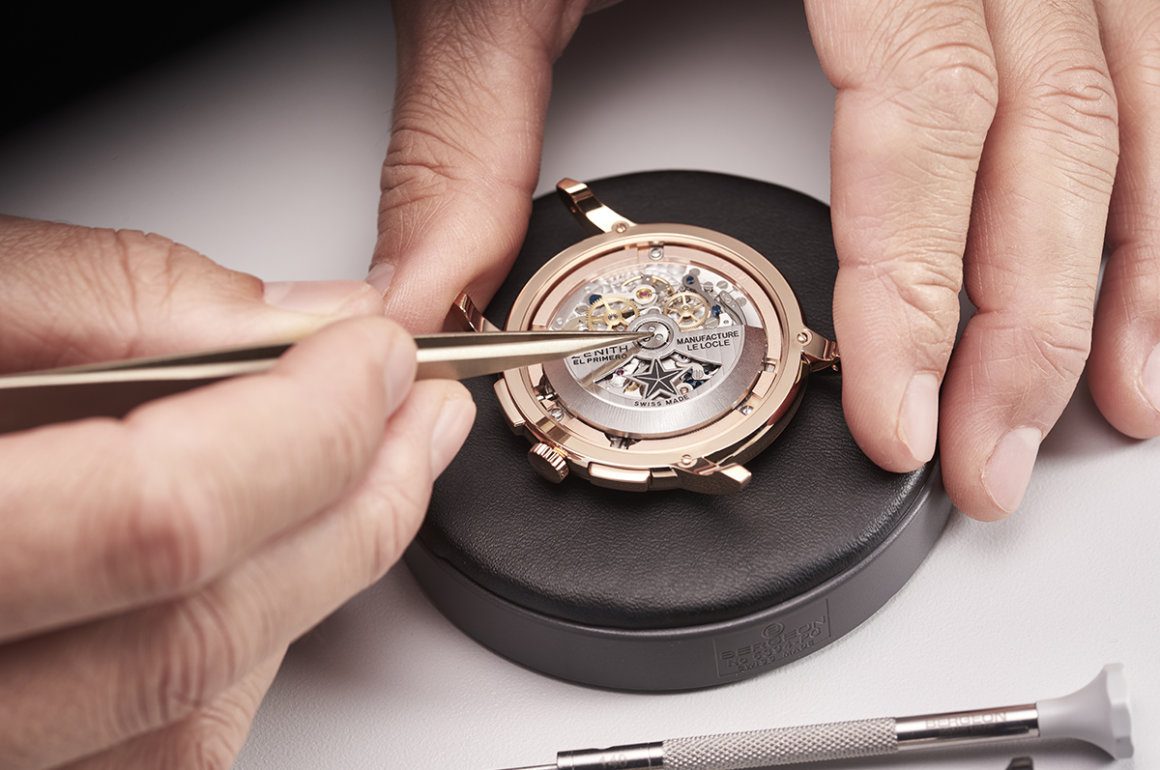 Luxury timepiece assembled by hand with tweezers