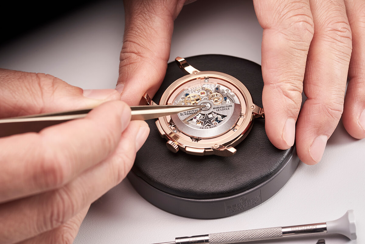 Luxury timepiece assembled by hand with tweezers