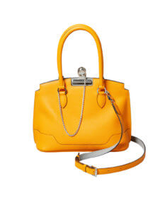 Bright yellow handbag with a metal bull dog clasp and chain