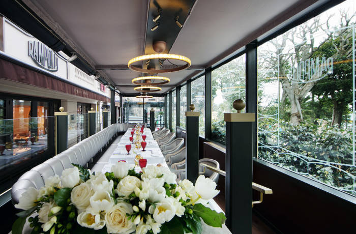 Luxury dining room with large windows into the gardens