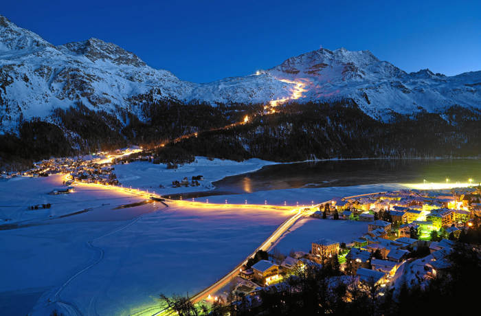 Ski slopes lit by lights at night in St. Mortiz