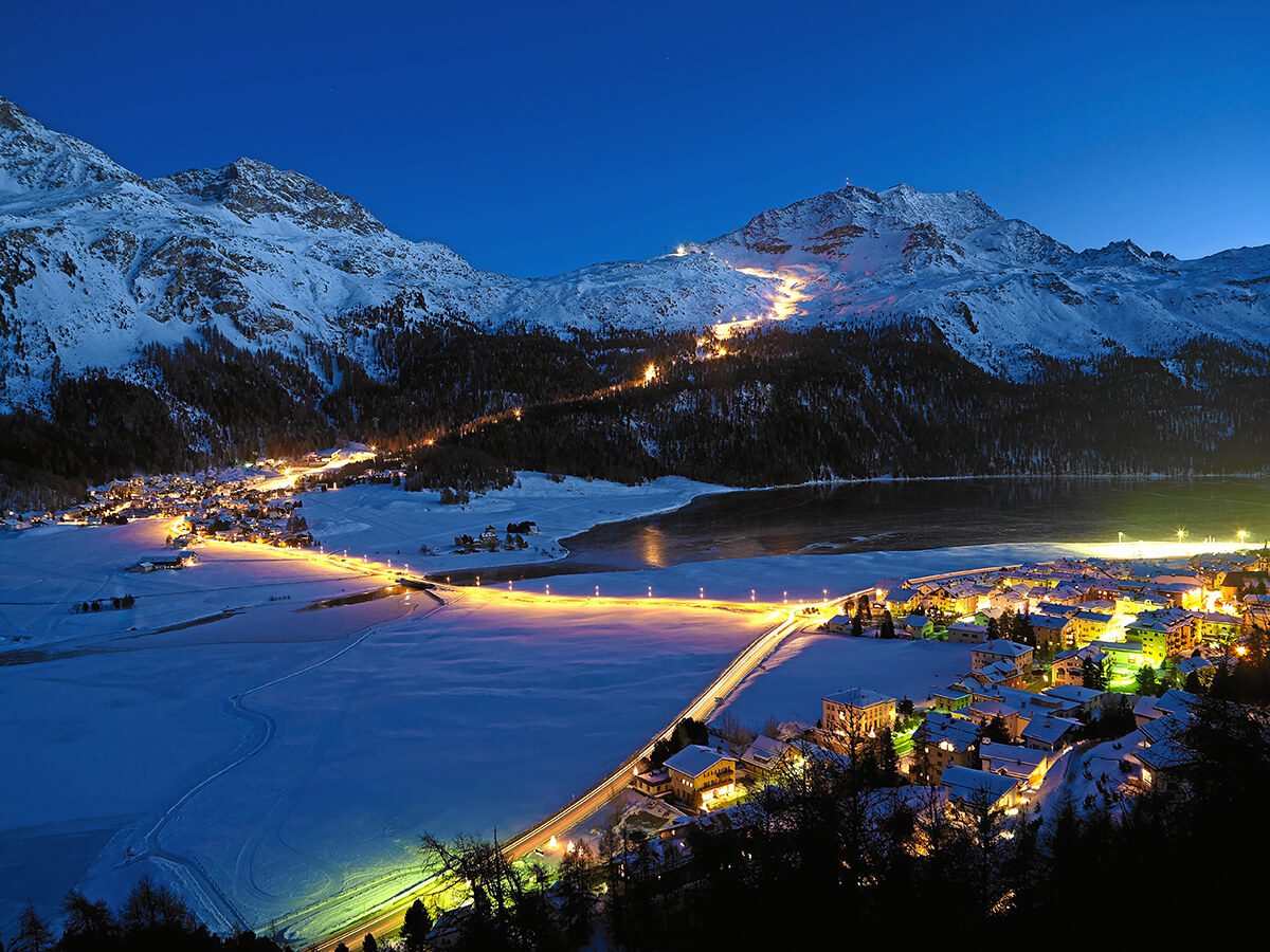 Ski slopes lit by lights at night in St. Mortiz