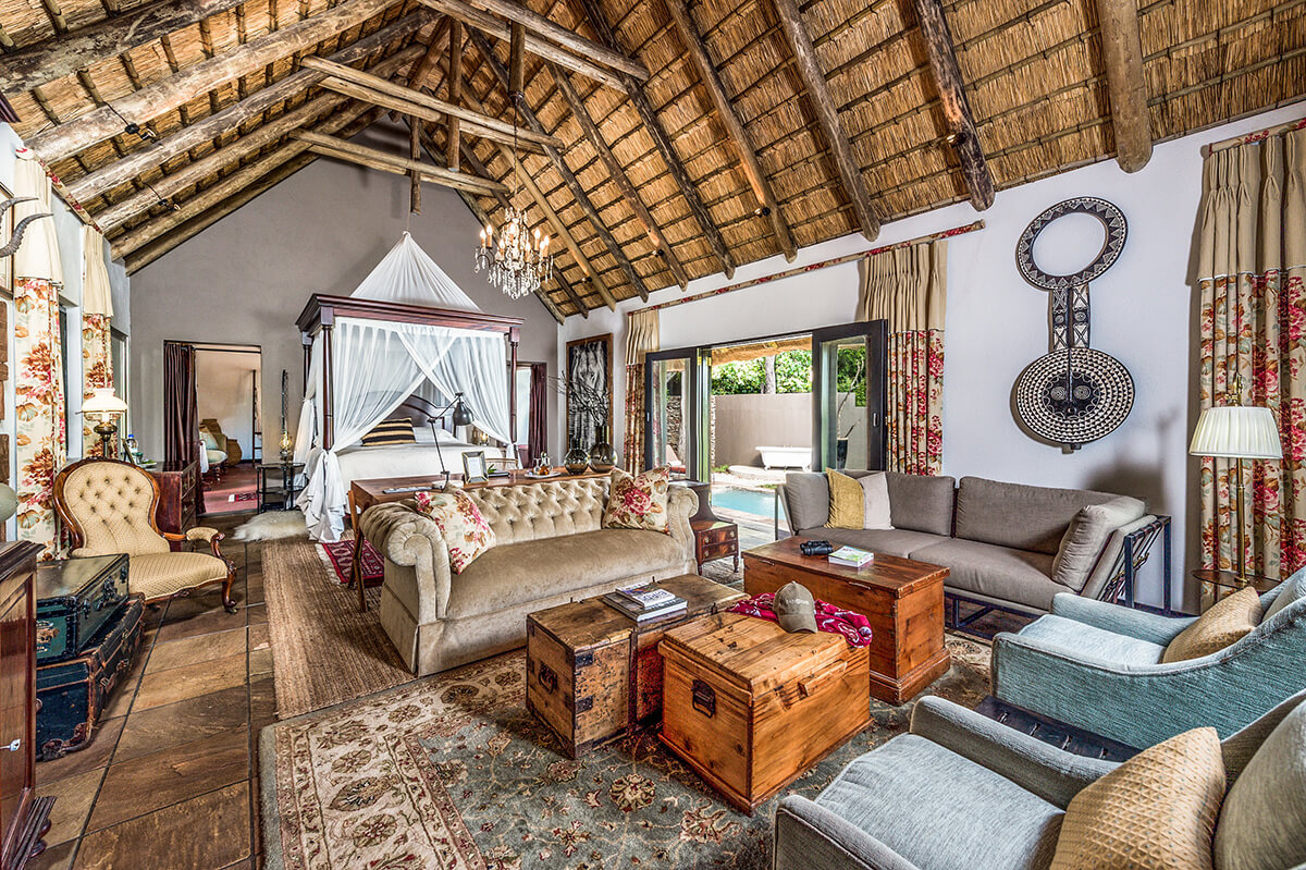 Suite at a traditional luxury safari camp in africa with vintage furnishings