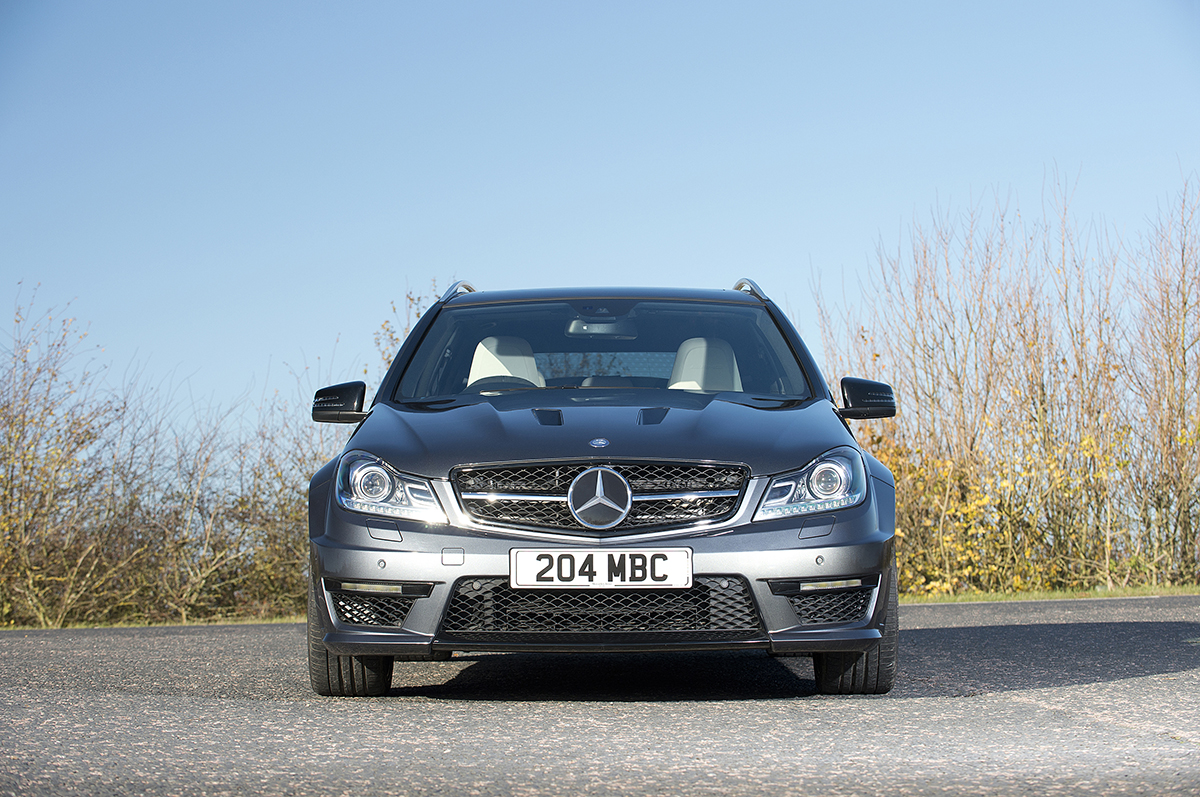 Mercedes-Benz silver estate car pictured from the front