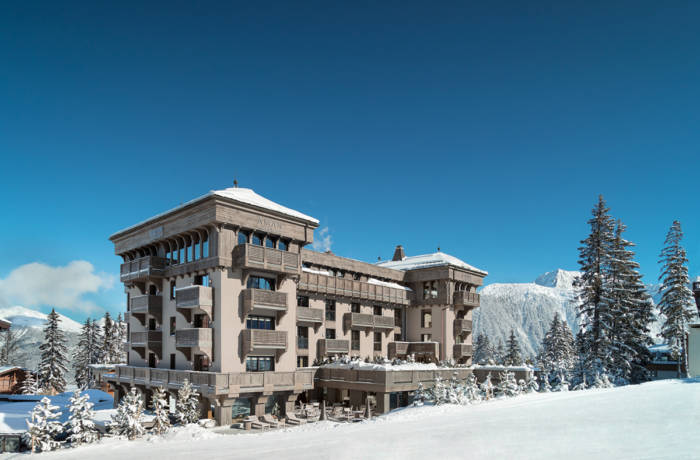 Exterior of luxury ski hotel on the edge of a piste