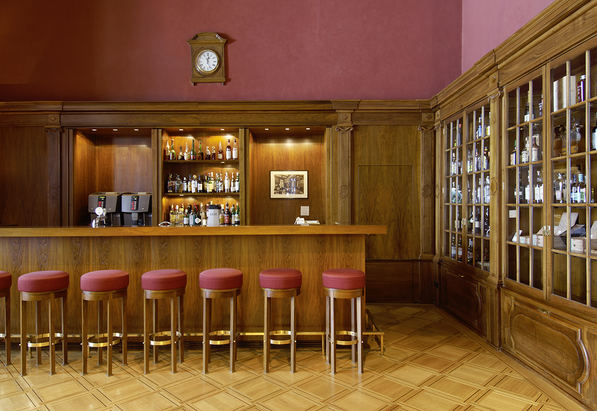 Luxury hotel bar decorated in maroon colours