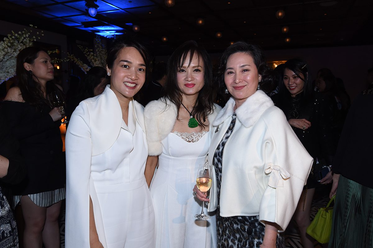 Three asian women at an after party in a club setting