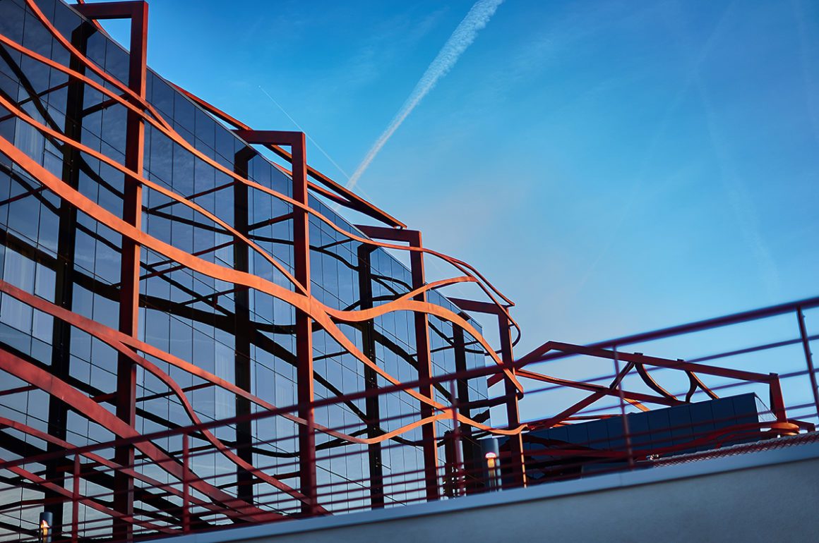 Contemporary architectural steel work on the facade of a glass building