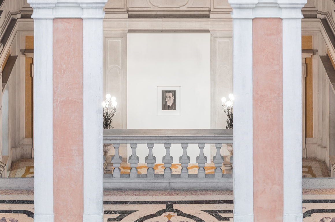 Installation shot of a Luc Tuymans exhibition with a small painting between two columns at the top of stairs
