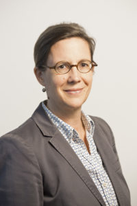 Portrait of business woman wearing suit and glasses