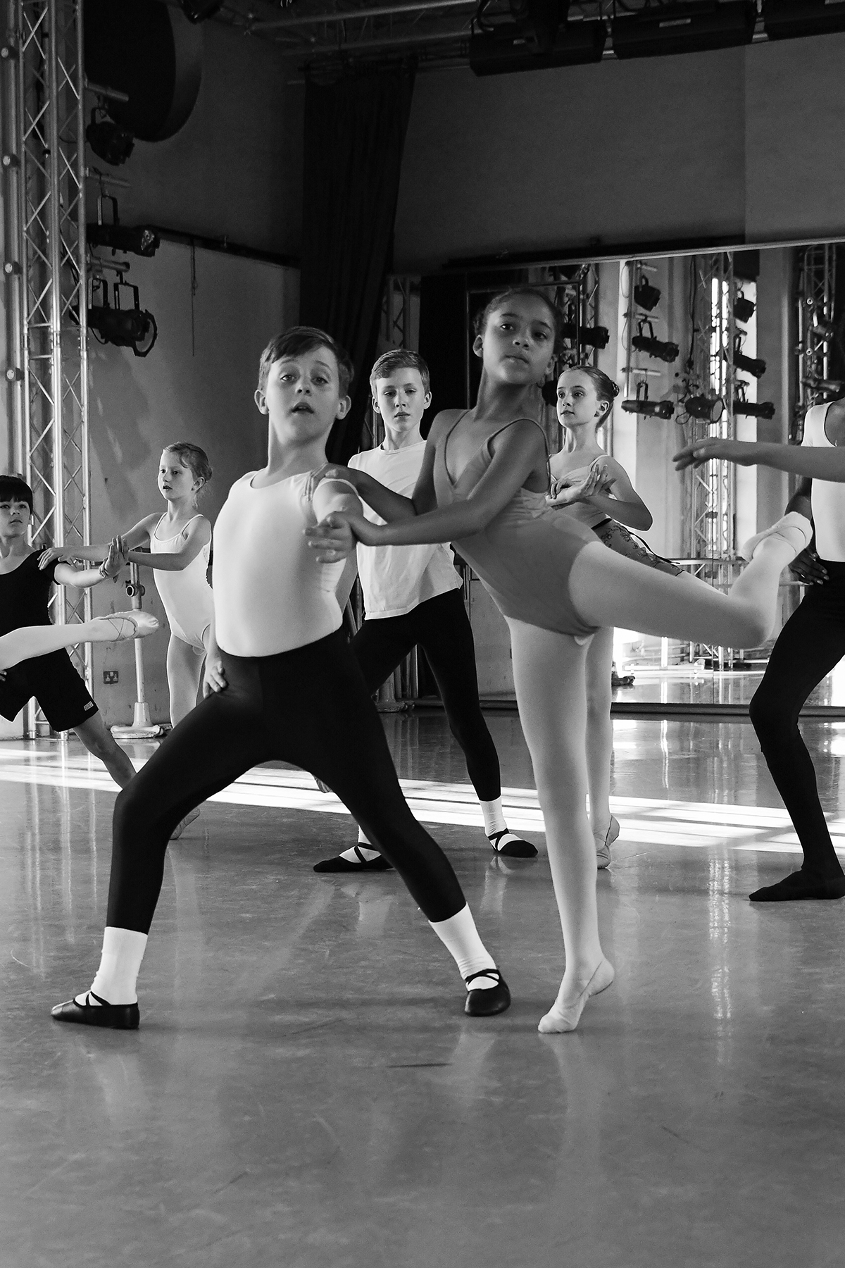 A child male and female dancer in the rehearsal studio